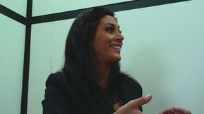 Trapped in the elevator, she pulls up her skirt